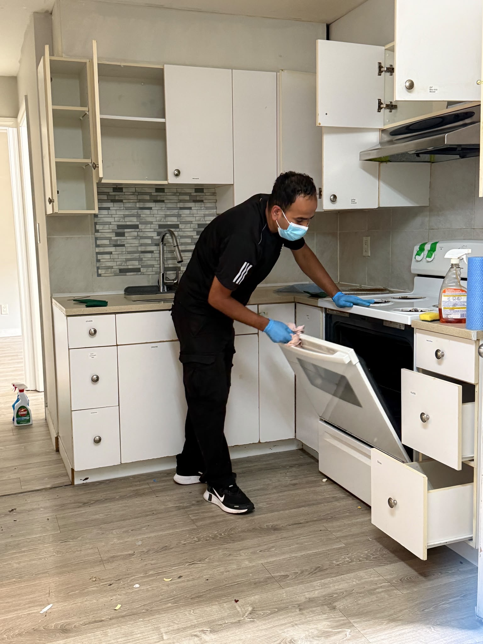 Loonie Cleaning Team Member Cleaning Kitchen